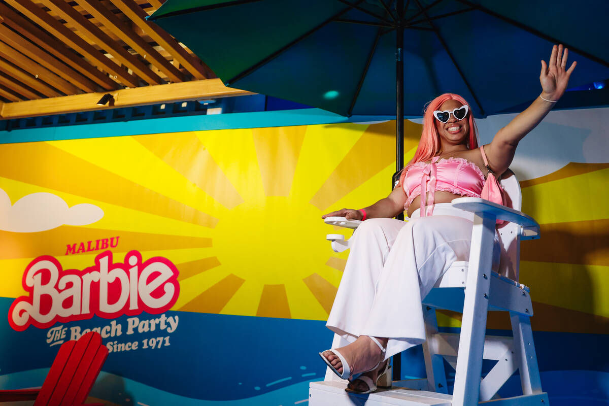 Tatiana Gilford sits in a lifeguard chair during the grand opening of the Malibu Barbie Cafe at ...