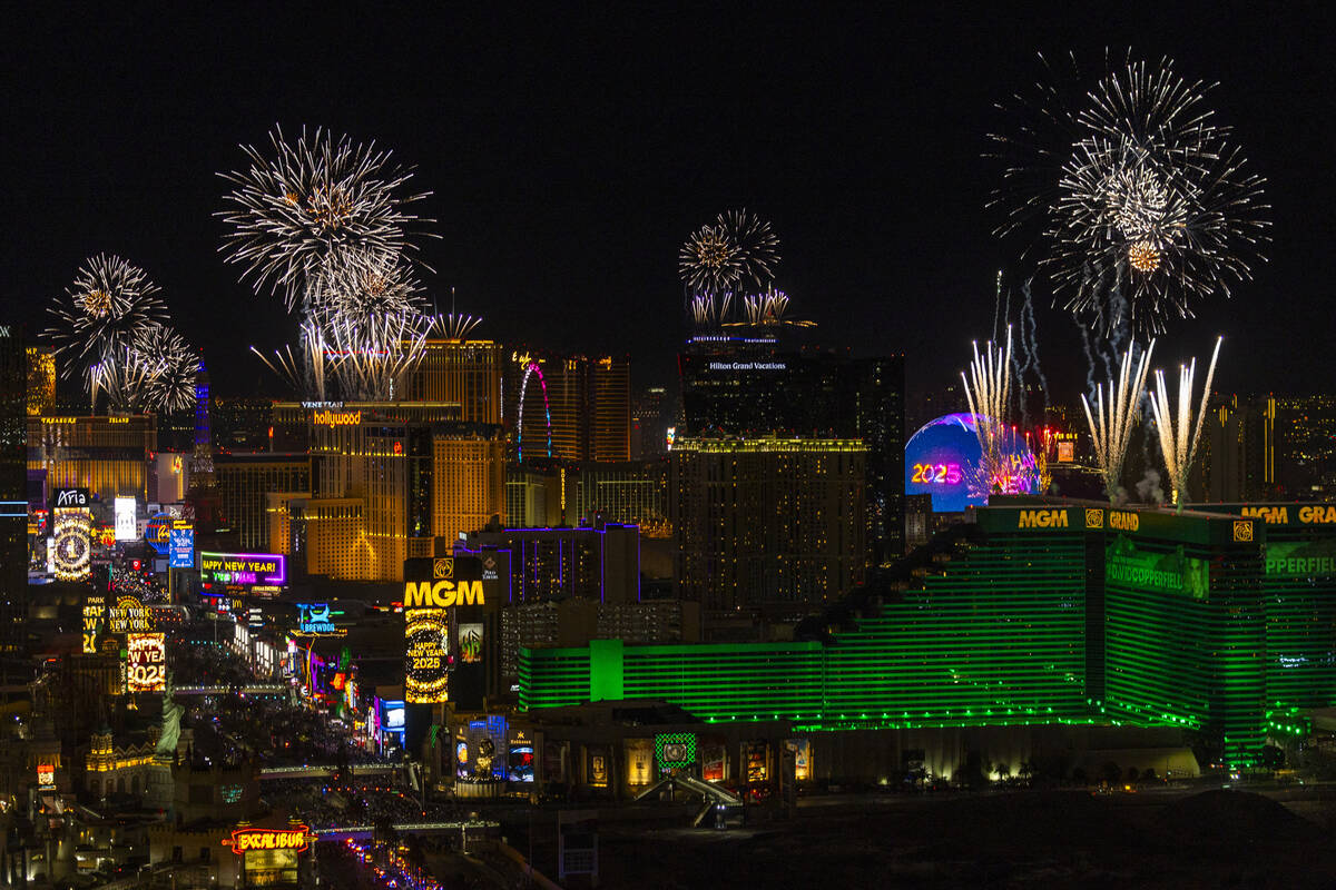 Fireworks erupt over the Strip as part of New Year's Eve celebrations across the city as v ...