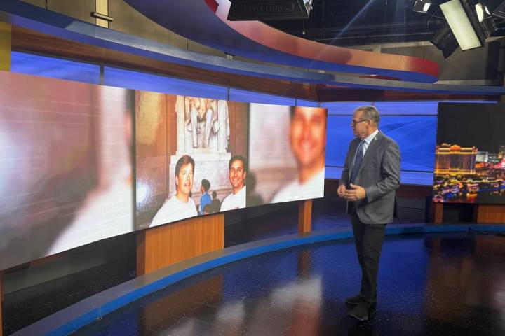 Jim Snyder is shown looking at scrapbook photos of him with his longtime friend and co-News 3 a ...
