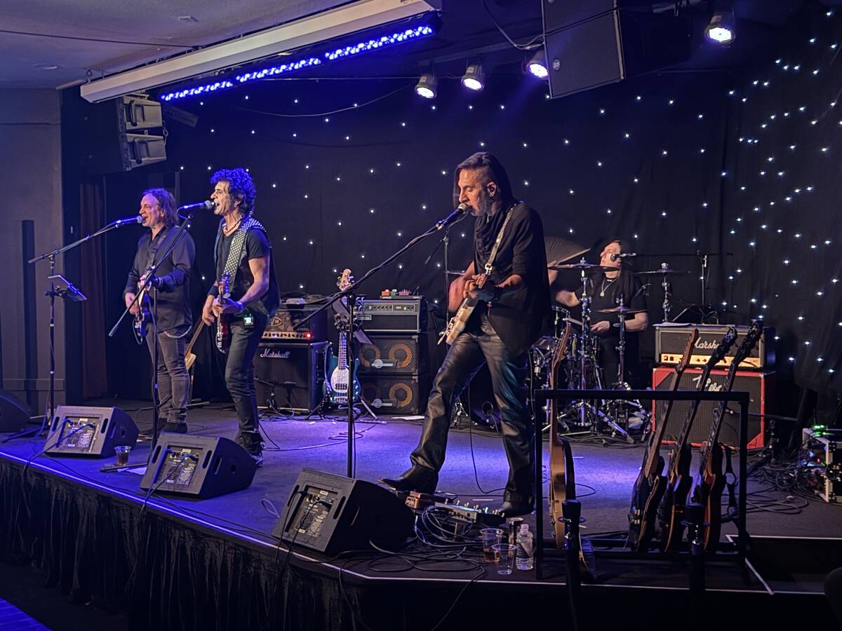 Phil Soussan, center, is backed by Zach Throne, left, Christian Brady, right, and drummer Brent ...