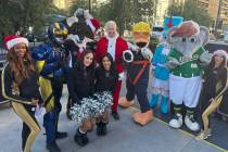 Opportunity Village CEO Bob Brown (center) is shown with a collection of Vegas pro-team mascots ...