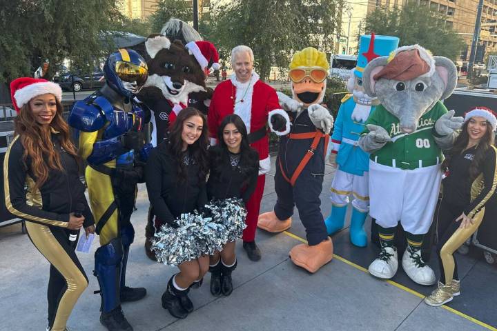 Opportunity Village CEO Bob Brown (center) is shown with a collection of Vegas pro-team mascots ...