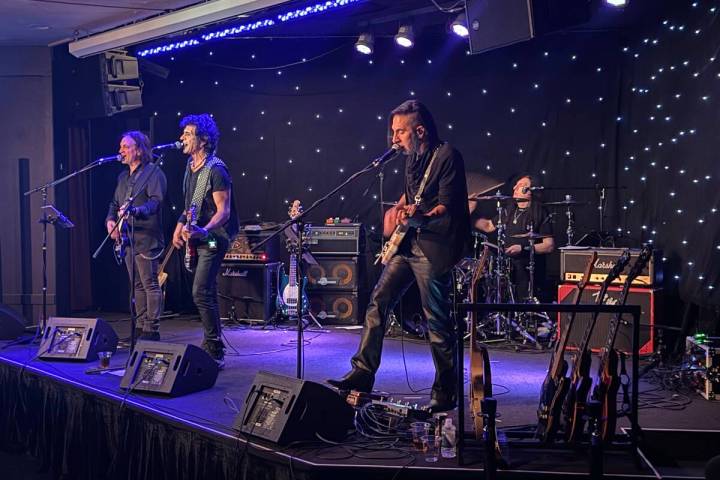 Phil Soussan, center, is shown with guitarists Zach Throne, left, Christian Brady, right, and d ...