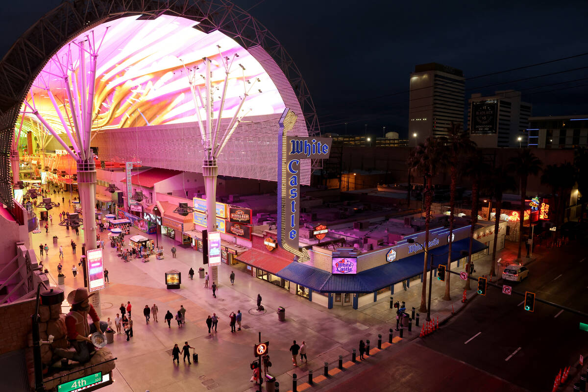 People walk through the Fremont Street Experience in downtown Las Vegas on Wednesday, Nov. 15, ...