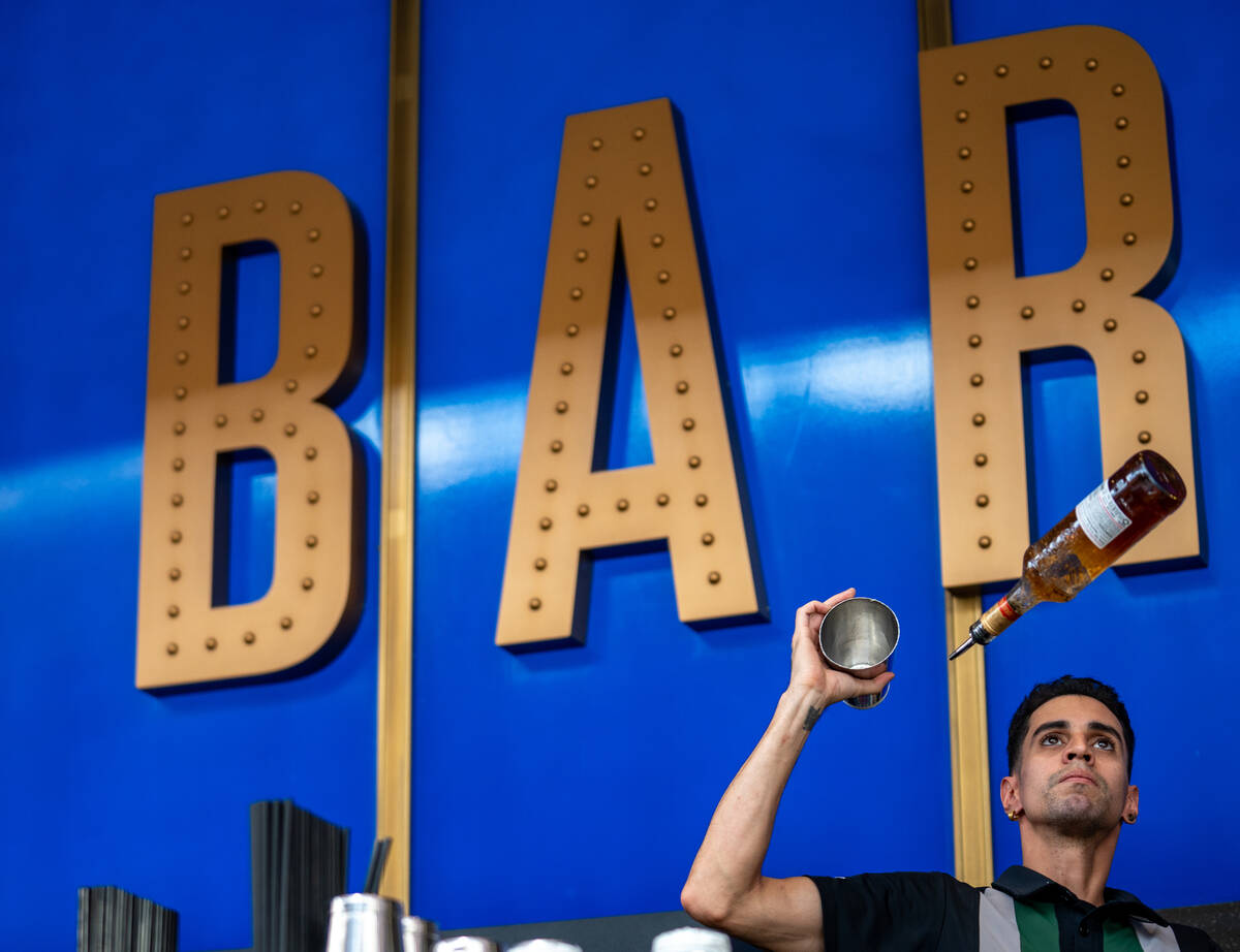 Circa Resort & Casino bartender Arturo Plasencia practices flair tricks with a mixing glass ...