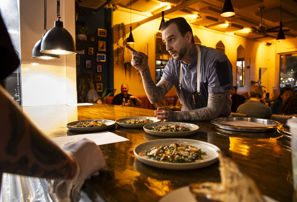 Chef de cuisine Jackson Stamper talks with his kitchen during a staff menu tasting at Adaȁ ...