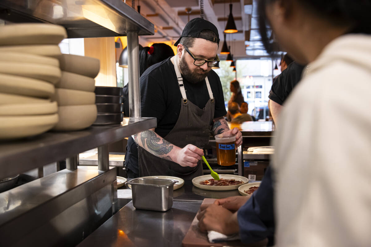 Sous chef Mick Skarda prepares a dish during a staff menu tasting at Ada’s on Wedne ...