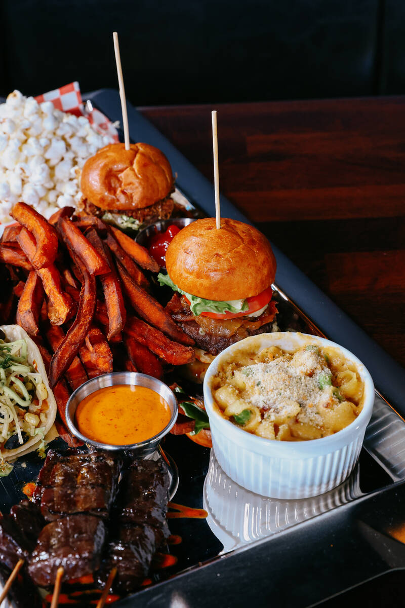 The St. Felix sample platter, featuring Malaysian-style steak skewers, wagyu slider, southern f ...