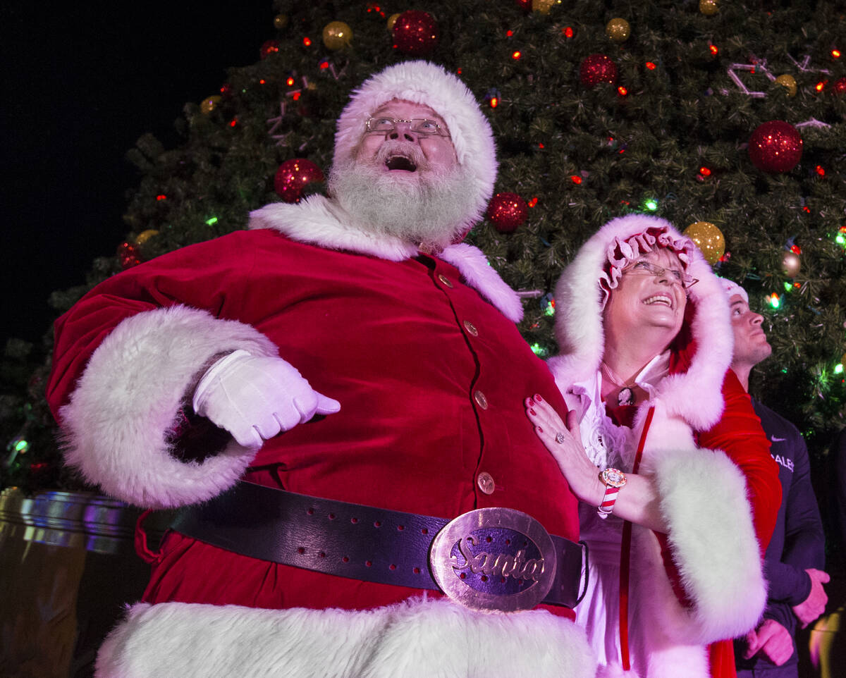 Santa and Mrs. Claus enjoy the fireworks at Opportunity Village's Magical Forest on Friday, Nov ...