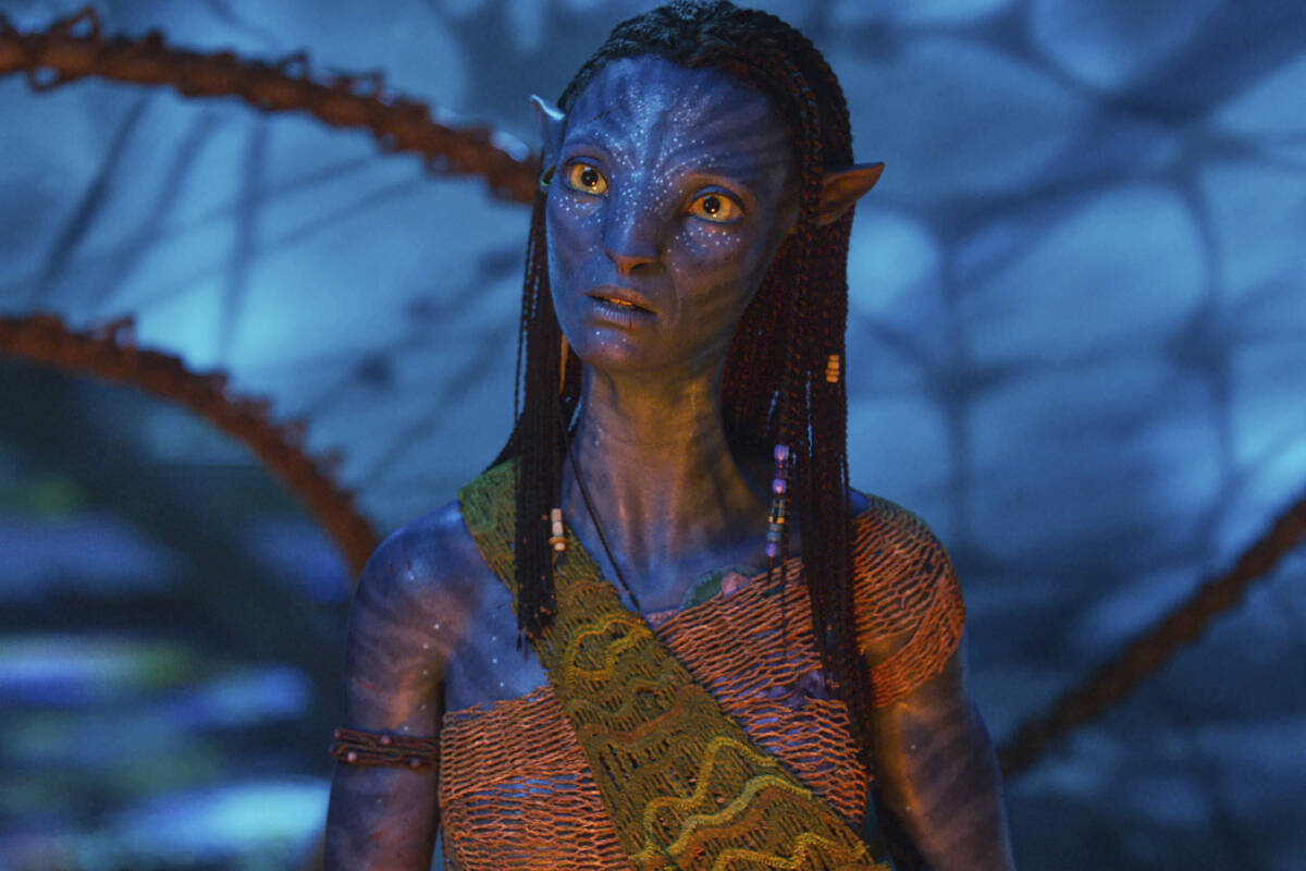 This image released by Disney shows Neytiri, played by Zoe Saldana, in a scene from "Avata ...