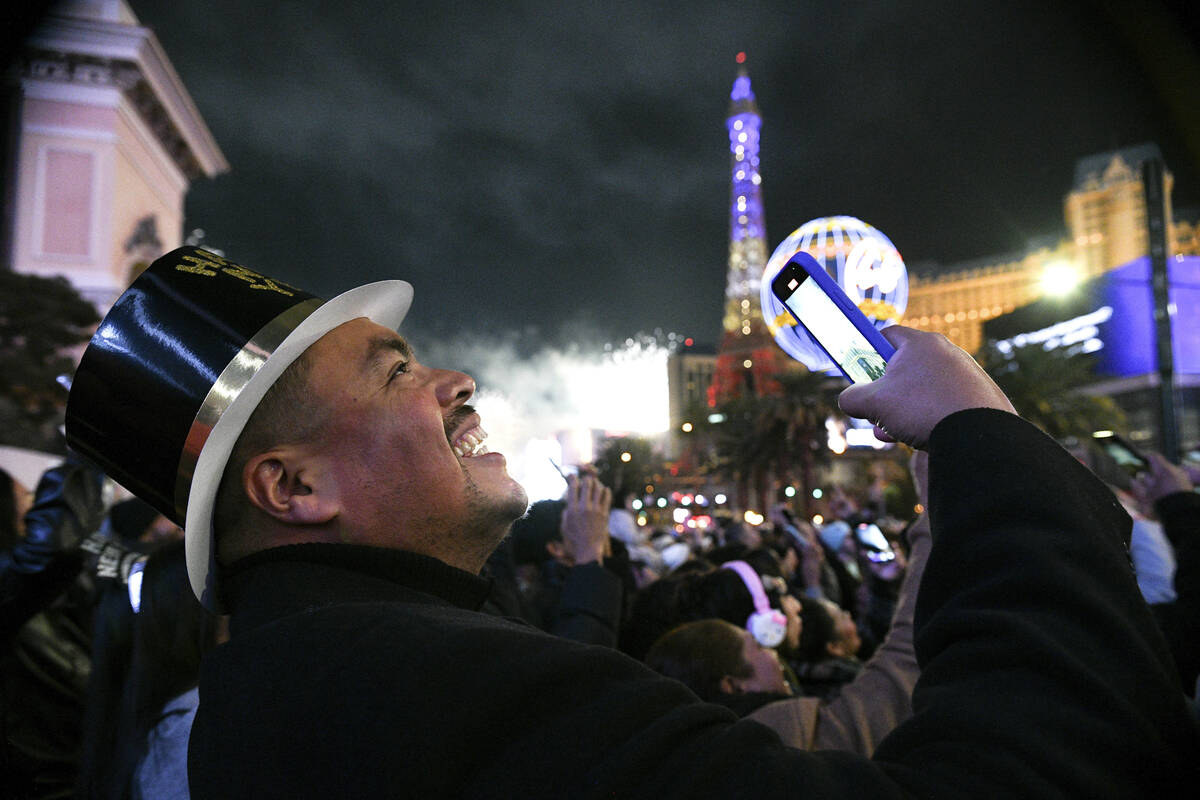 Carlos Valdez from Los Angeles smiles while watching New Year's Eve fireworks on the Strip ...