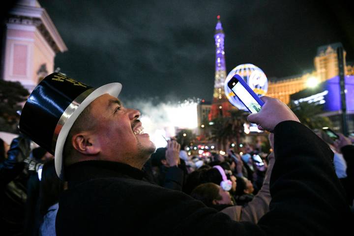 Carlos Valdez from Los Angeles smiles while watching New Year's Eve fireworks on the Strip ...