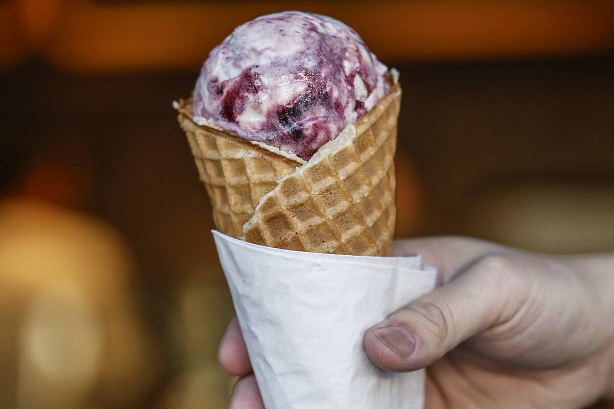 Chris Phu holds a waffle cone of Pots of Gold and Rainbows two days before the opening of Salt ...