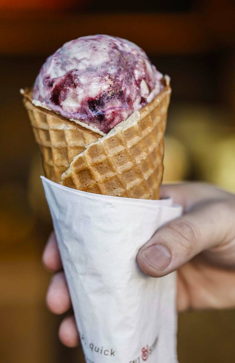 Chris Phu holds a waffle cone of Pots of Gold and Rainbows two days before the opening of Salt ...