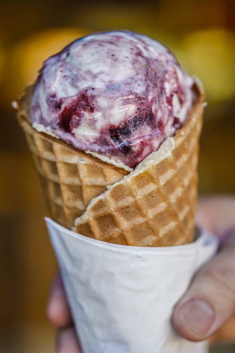 Chris Phu holds a waffle cone of Pots of Gold and Rainbows two days before the opening of Salt ...