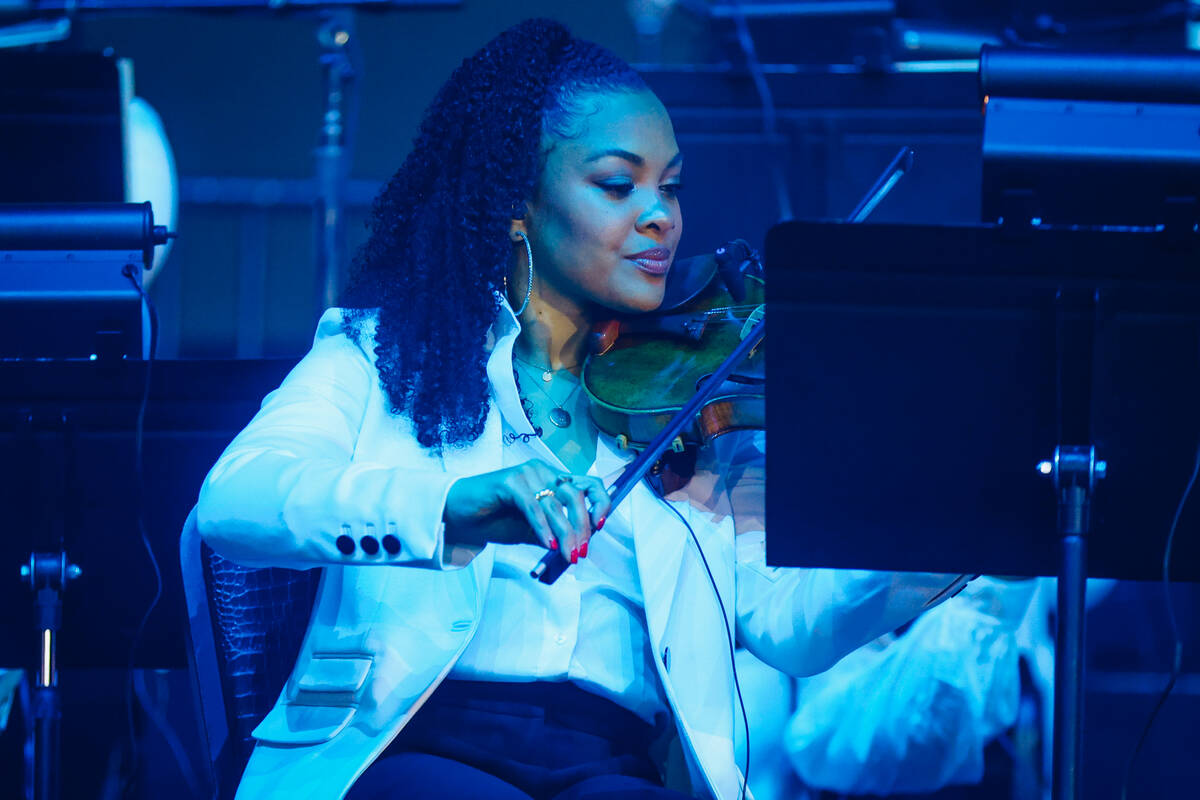 A musician performs in an orchestra at Young Jeezy’s concert at Planet Hollywood Friday, ...