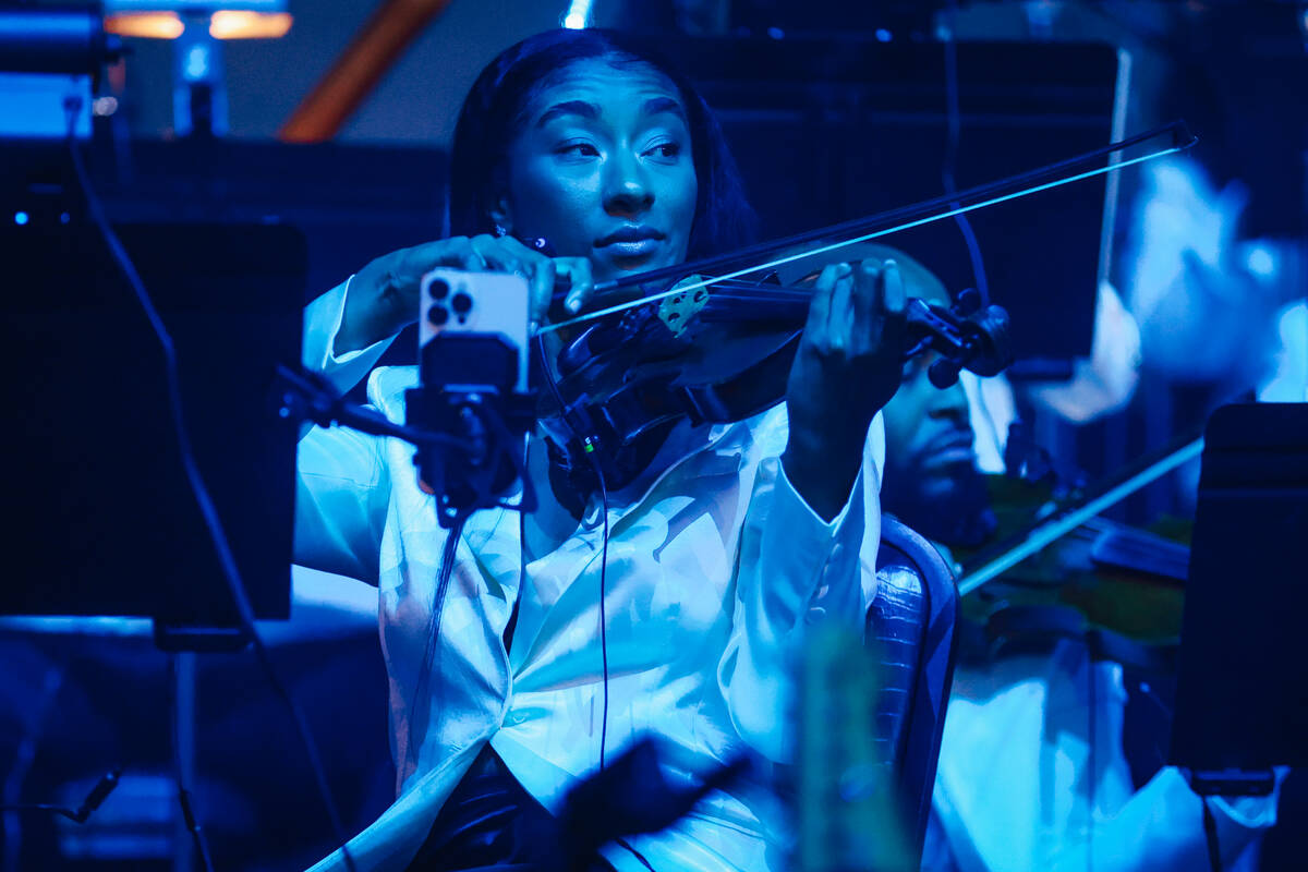 A musician performs in an orchestra at Young Jeezy’s concert at Planet Hollywood Friday, ...