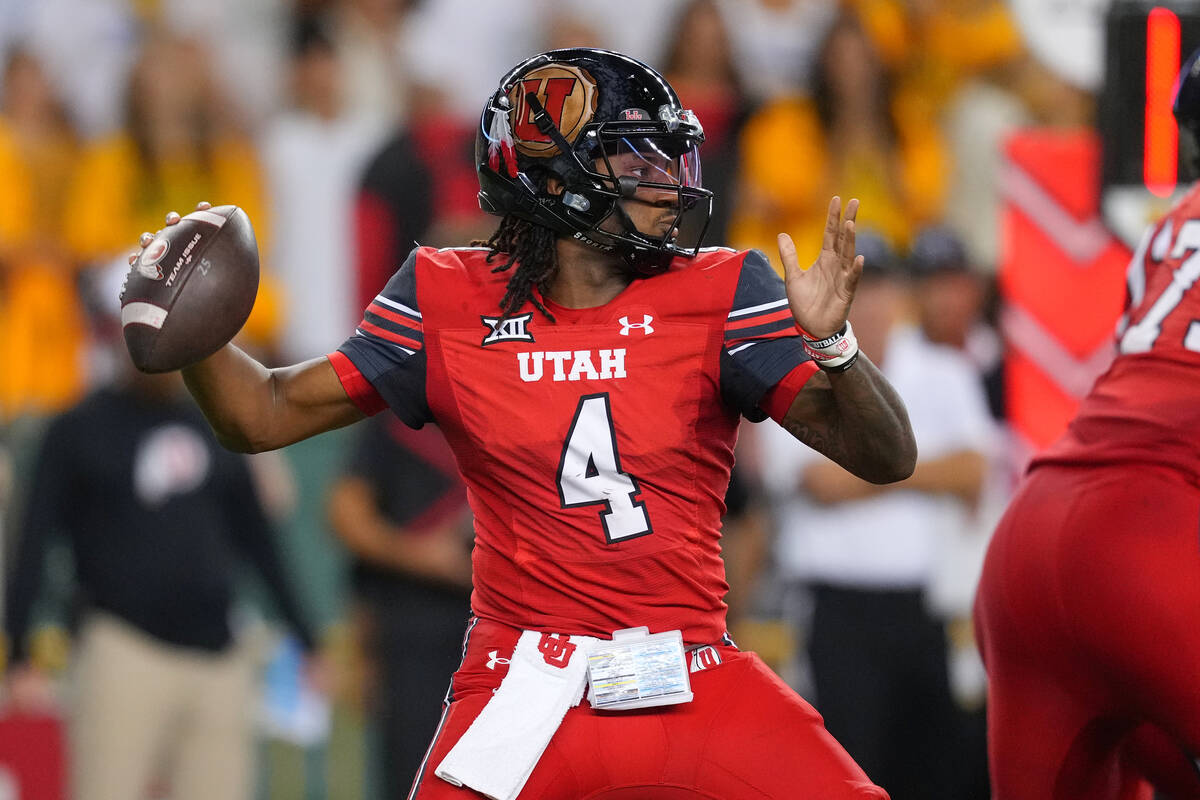 Utah quarterback Devon Dampier throws a pass against Baylor during the first half of an NCAA co ...