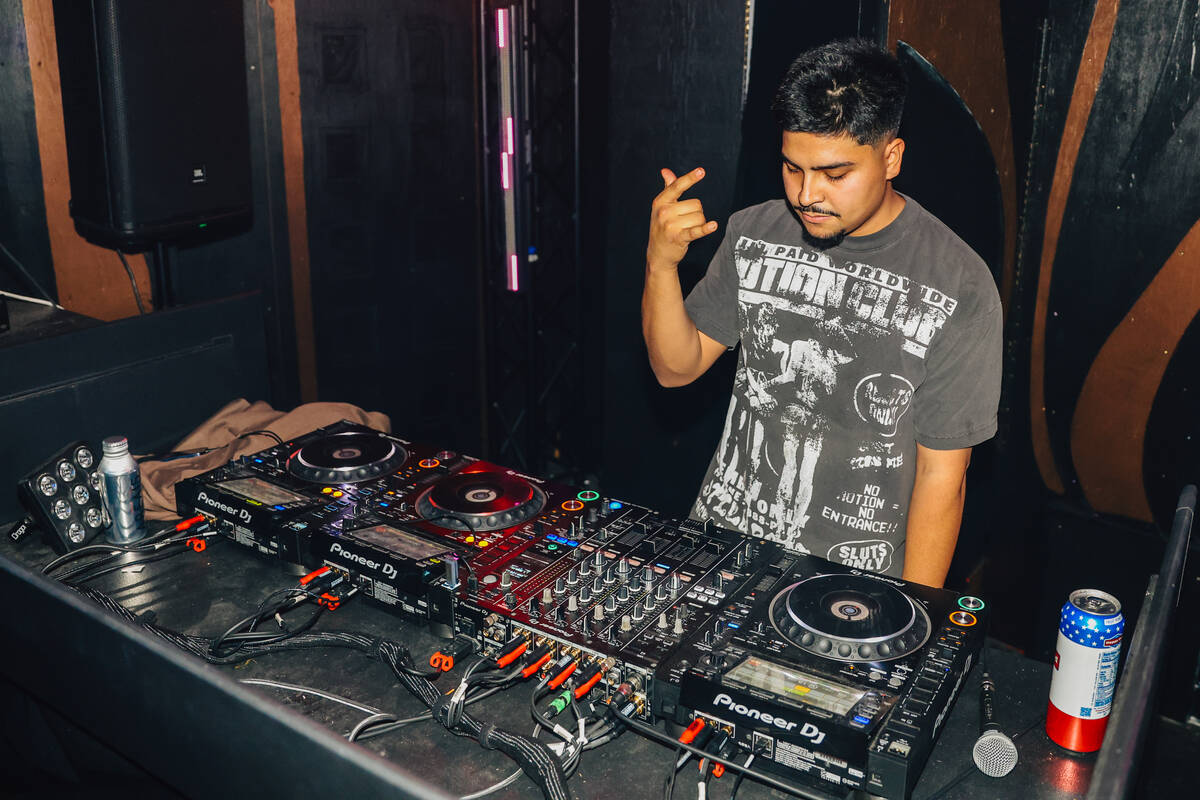 A DJ performs at Oddyssey Noir at Area15 Saturday, Dec. 13, 2025, in Las Vegas. (Madeline Carte ...
