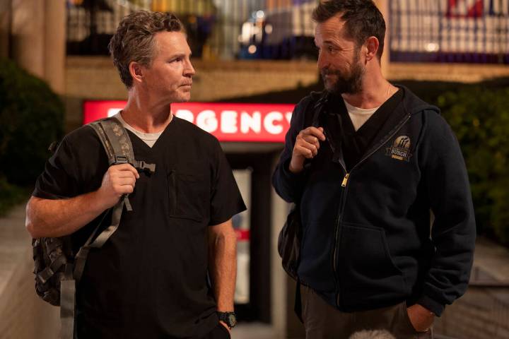 Robby (Noah Wyle), right, and Abbott (Shawn Hatosy) exit the hospital in a scene from "The ...