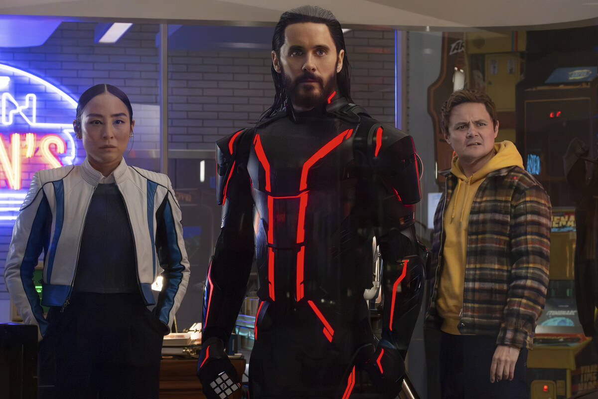 This image released by Disney shows Greta Lee, from left, Jared Leto and Arturo Castro in a sce ...