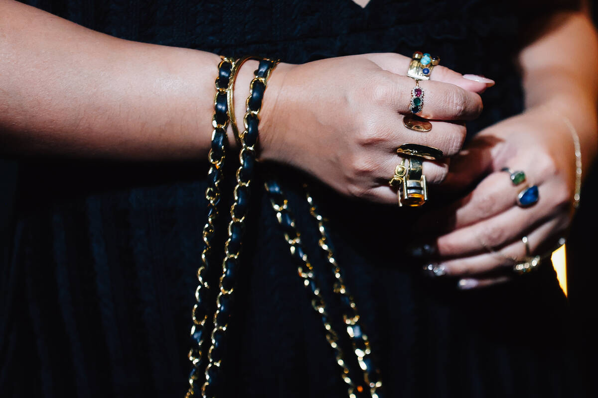 A guest wears jewelry on a red carpet during the opening party at Gymkhana in the Aria Friday, ...