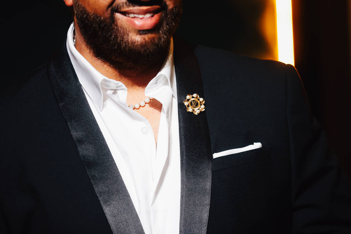 A guest smiles on a red carpet during the opening party at Gymkhana in the Aria Friday, Jan. 16 ...