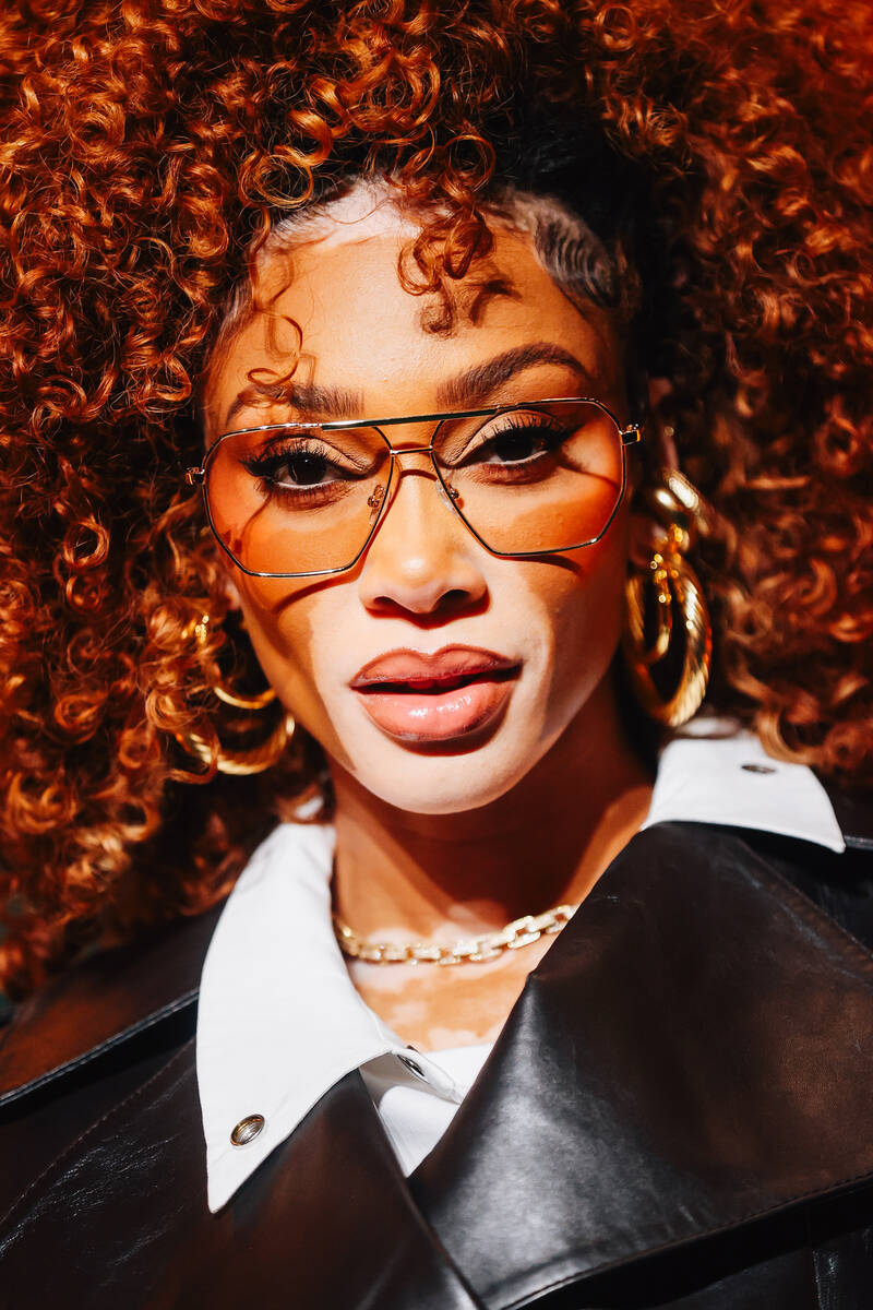 Model Winnie Harlow poses with peacocks on a red carpet during the opening party at Gymkhana in ...