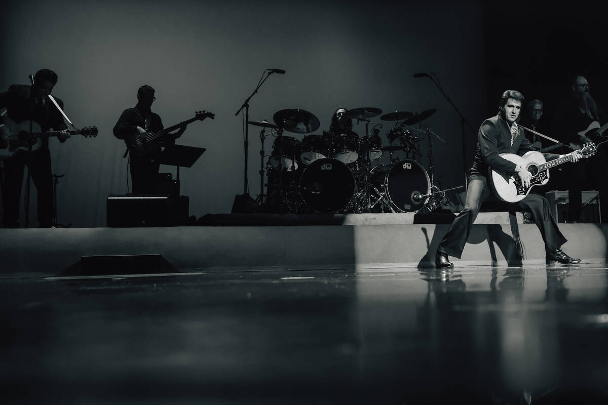 Travis Powell, an Elvis tribute artist, performs during “1969 Live Concert: The King Ret ...