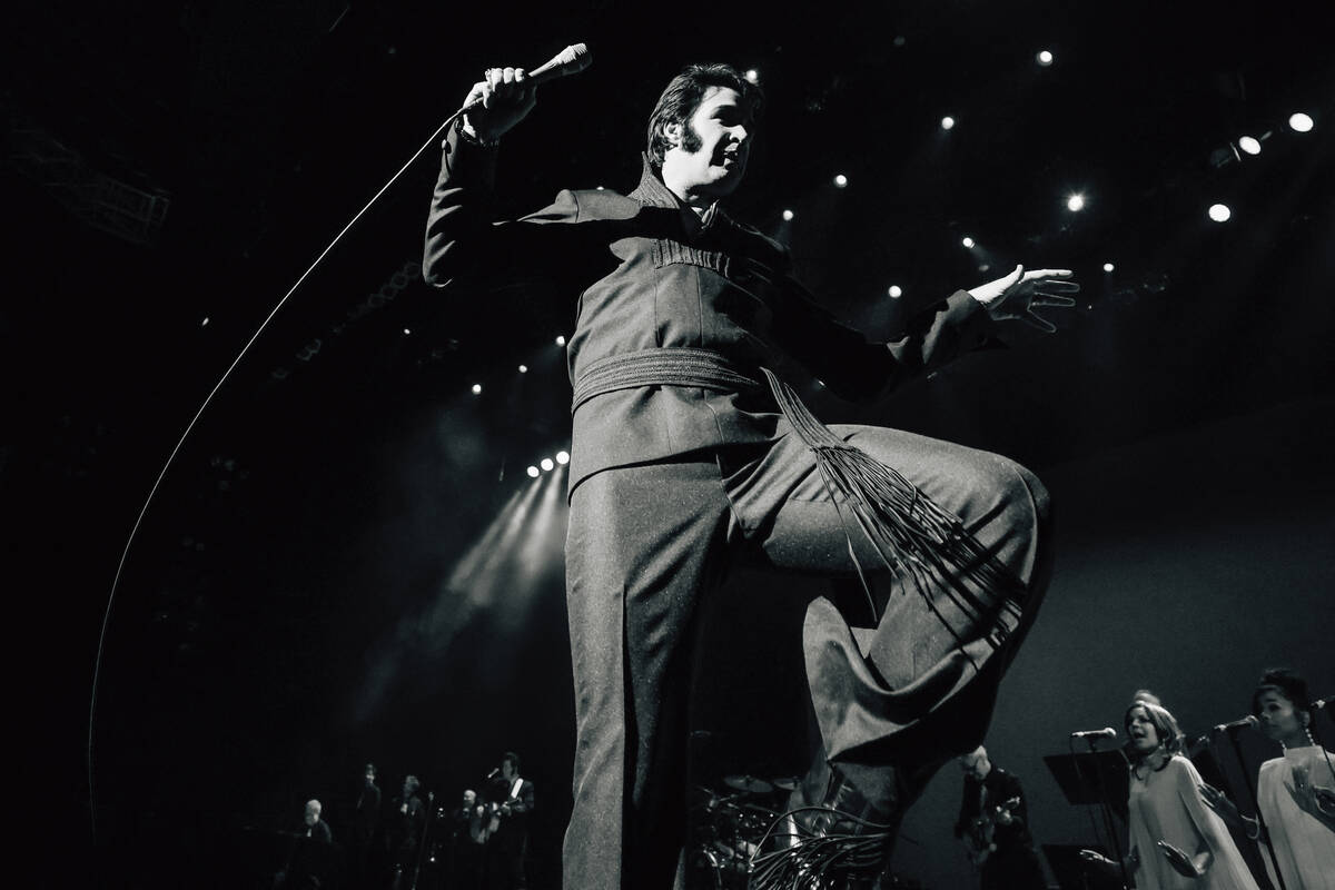 Travis Powell, an Elvis tribute artist, performs during “1969 Live Concert: The King Ret ...