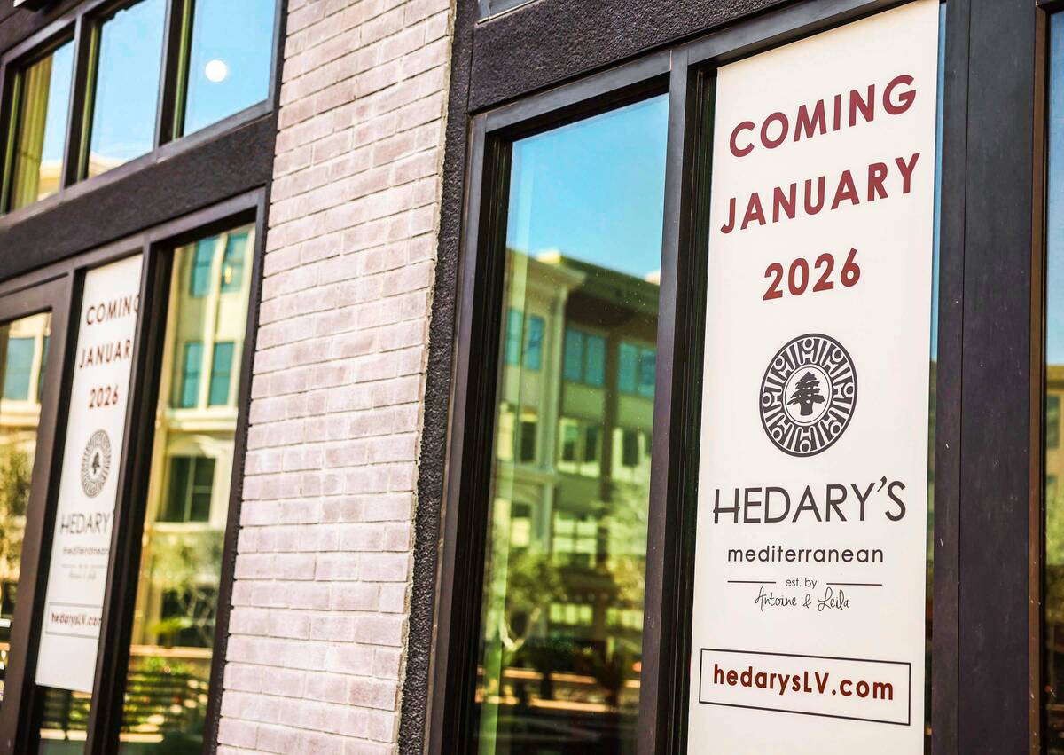 Signs announcing the opening date of Hedary's Mediterranean are seen on the exterior of the res ...