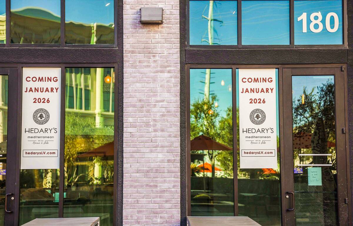 Signs announcing the opening date of Hedary's Mediterranean are seen on the exterior of the res ...
