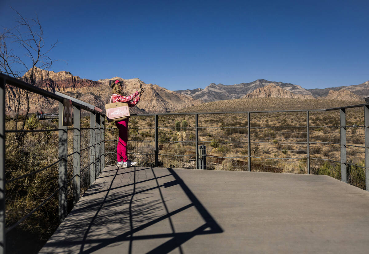 People take photos outside the visitors center at Red Rock Canyon National Conservation Area du ...