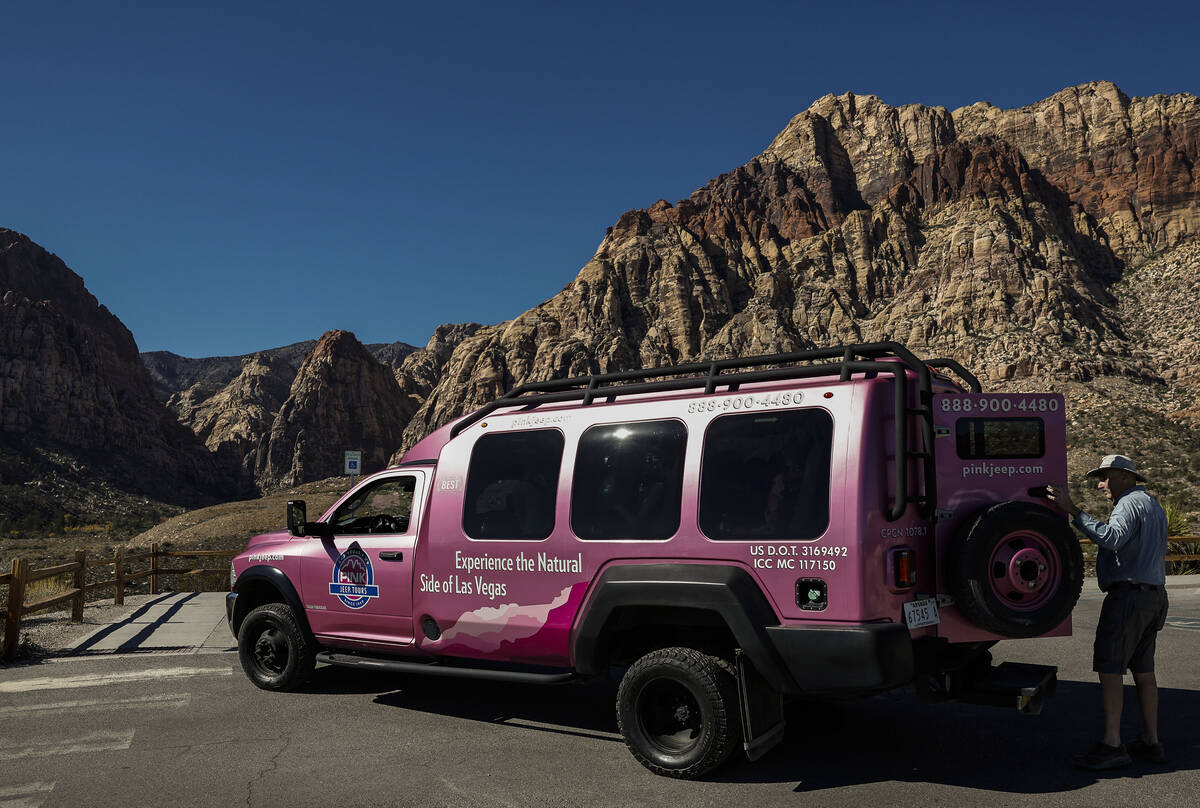 Adventure tour guide Mike Metzger loads clients in a Pink Jeep Tour vehicle at Red Rock Canyon ...