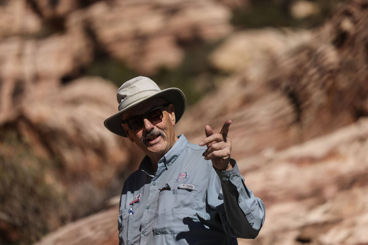 Adventure tour guide Mike Metzger points out significant elements of Red Rock Canyon National C ...