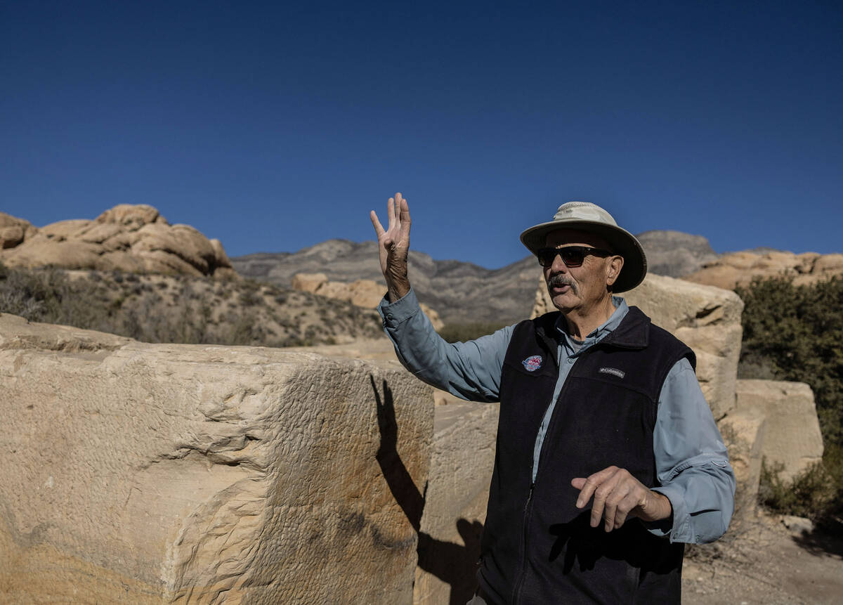 Adventure tour guide Mike Metzger points out significant elements of Red Rock Canyon National C ...