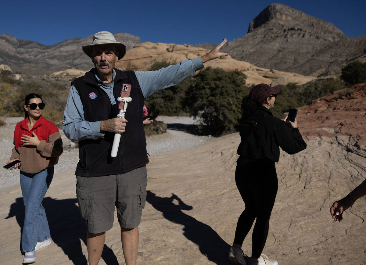 Adventure tour guide Mike Metzger points out significant elements of Red Rock Canyon National C ...