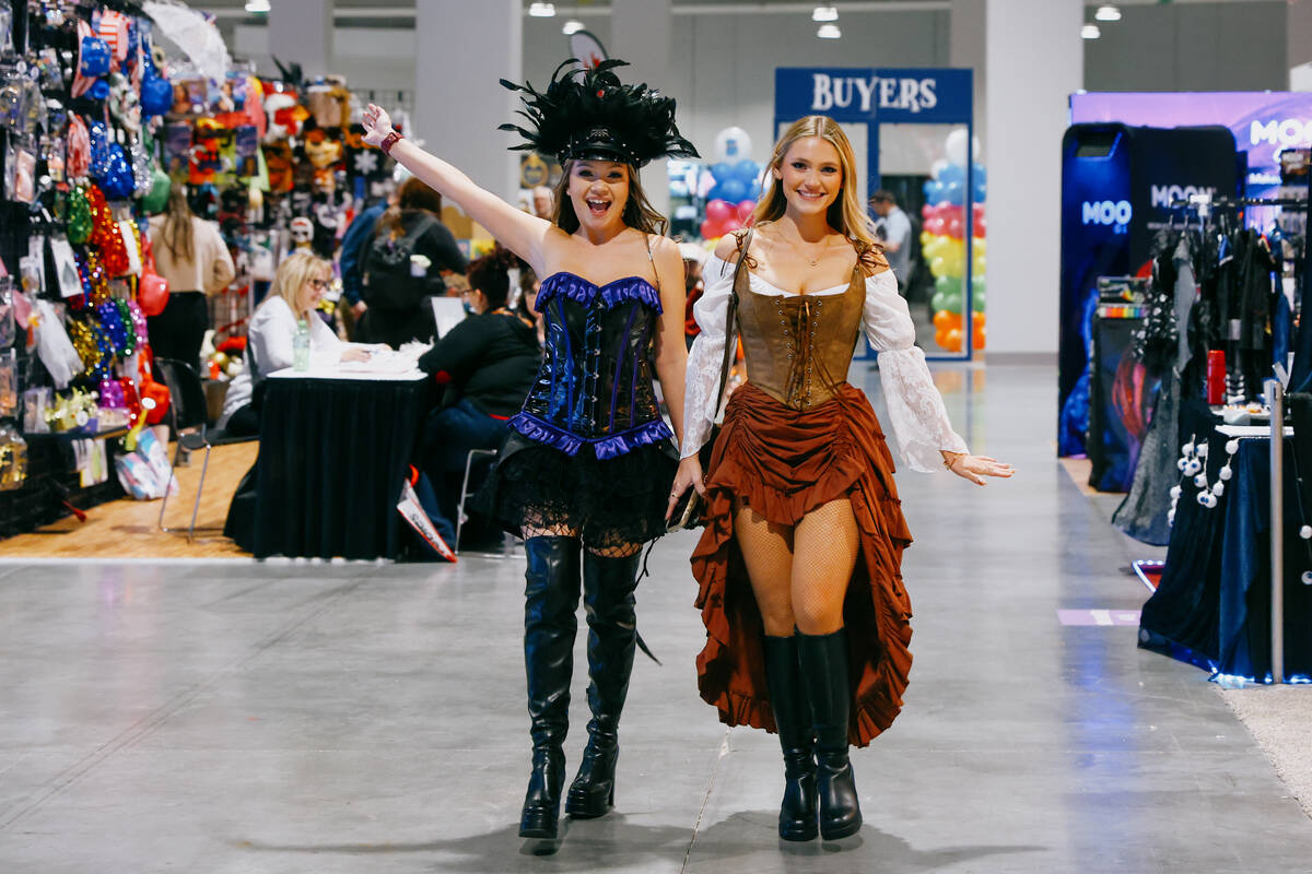 Cienna Butler and Megan Tingle pose for a portrait while walking in costumes during the Hallowe ...