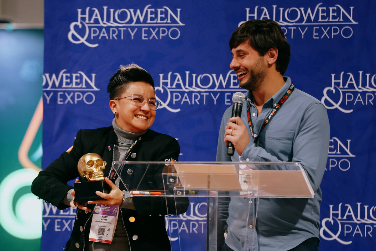 Neri Juarez and Esteban Esponda accept the Spooky Award for best adult costume on behalf of the ...