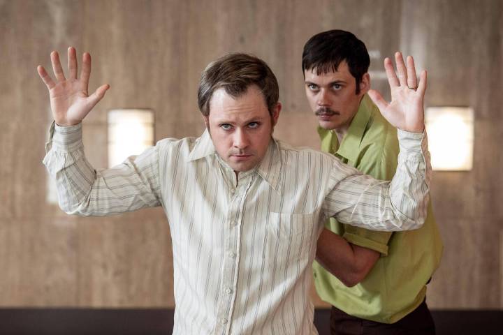 Bill Skarsgård, left, and Dacre Montgomery in a scene from "Dead Man's Wire.&quo ...