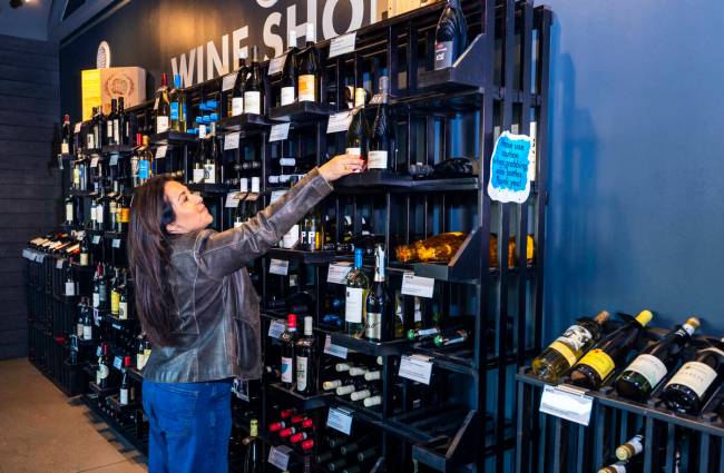 Alex Gilbert looks at some of the variety of wine for sale in the shop at the Azzurra Wine Bar ...