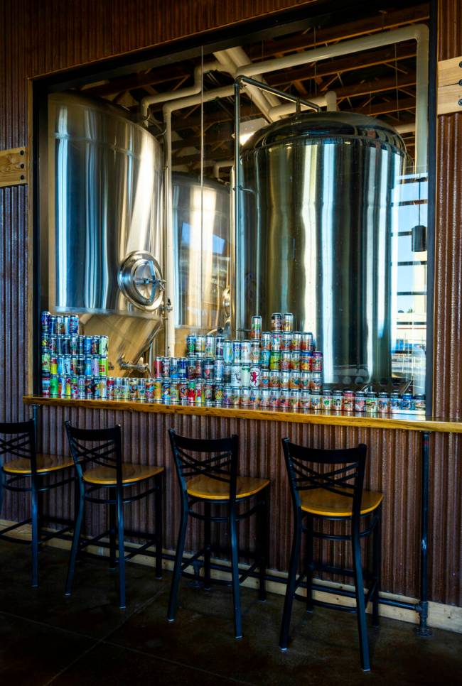 Brewing tanks are filled behind the glass and will produce a variety of craft beers at the Love ...