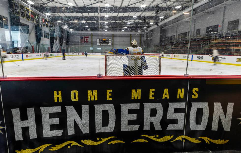 Hockey players work the ice on a rink in the America First Center along Water Street on Friday, ...