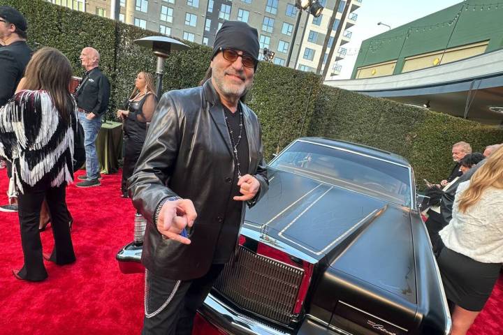 Danny Koker is shown with his restored 1978 Lincoln Continental, which auctioned for $300,000 a ...