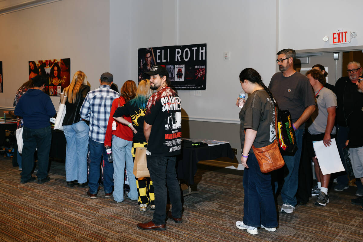 Fans wait in line to receive an autograph from Eli Roth during Days of the Dead Las Vegas on Fr ...