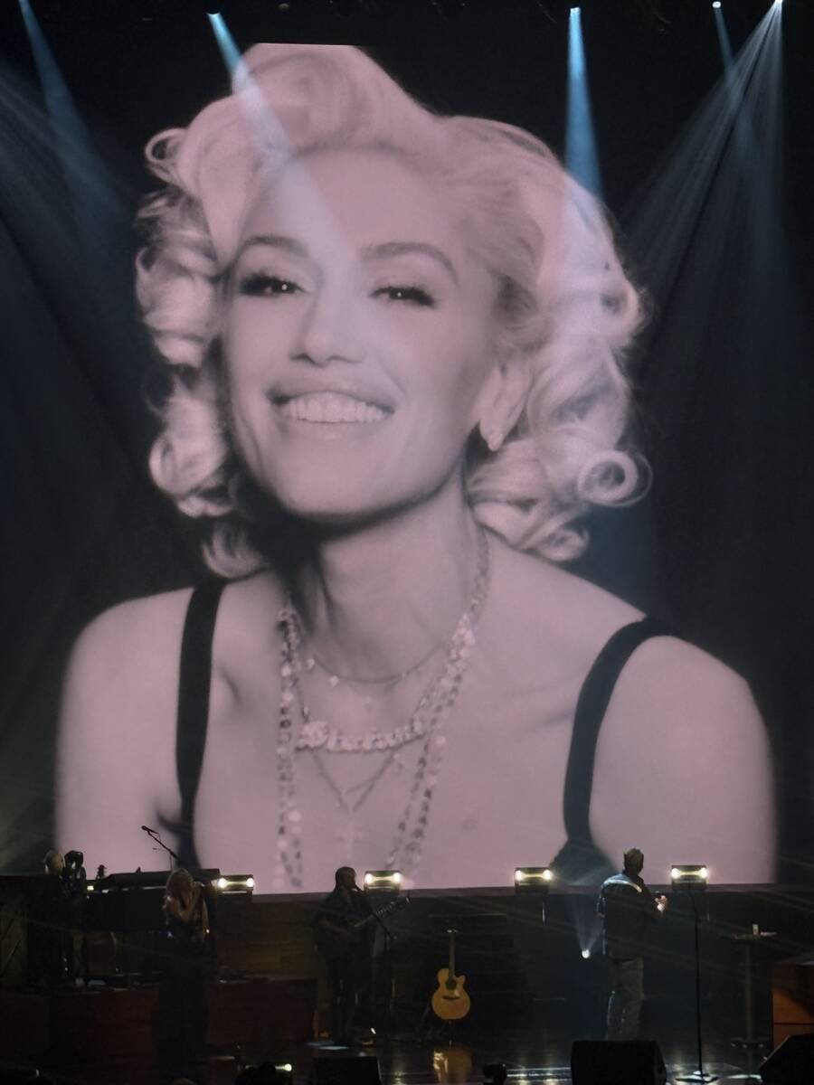 An image of Gwen Stefani is shown as Blake Shelton performs "Nobody But You" at the opening of ...