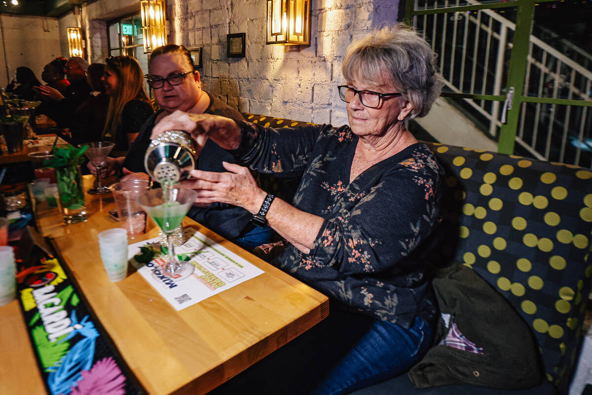 Students pour their drinks during a mixology class at F The Bar Friday, Jan. 9, 2026, in Las Ve ...