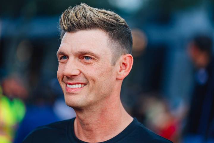 Nick Carter of the Backstreet Boys smiles during a parade in honor of Summerlin South at Downto ...