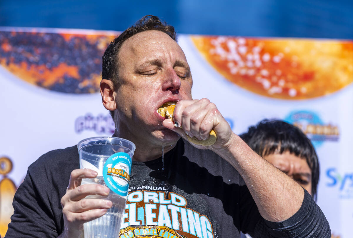 Joey Chestnut, the number-one-ranked competitive eater in the world, devours another bagel as h ...