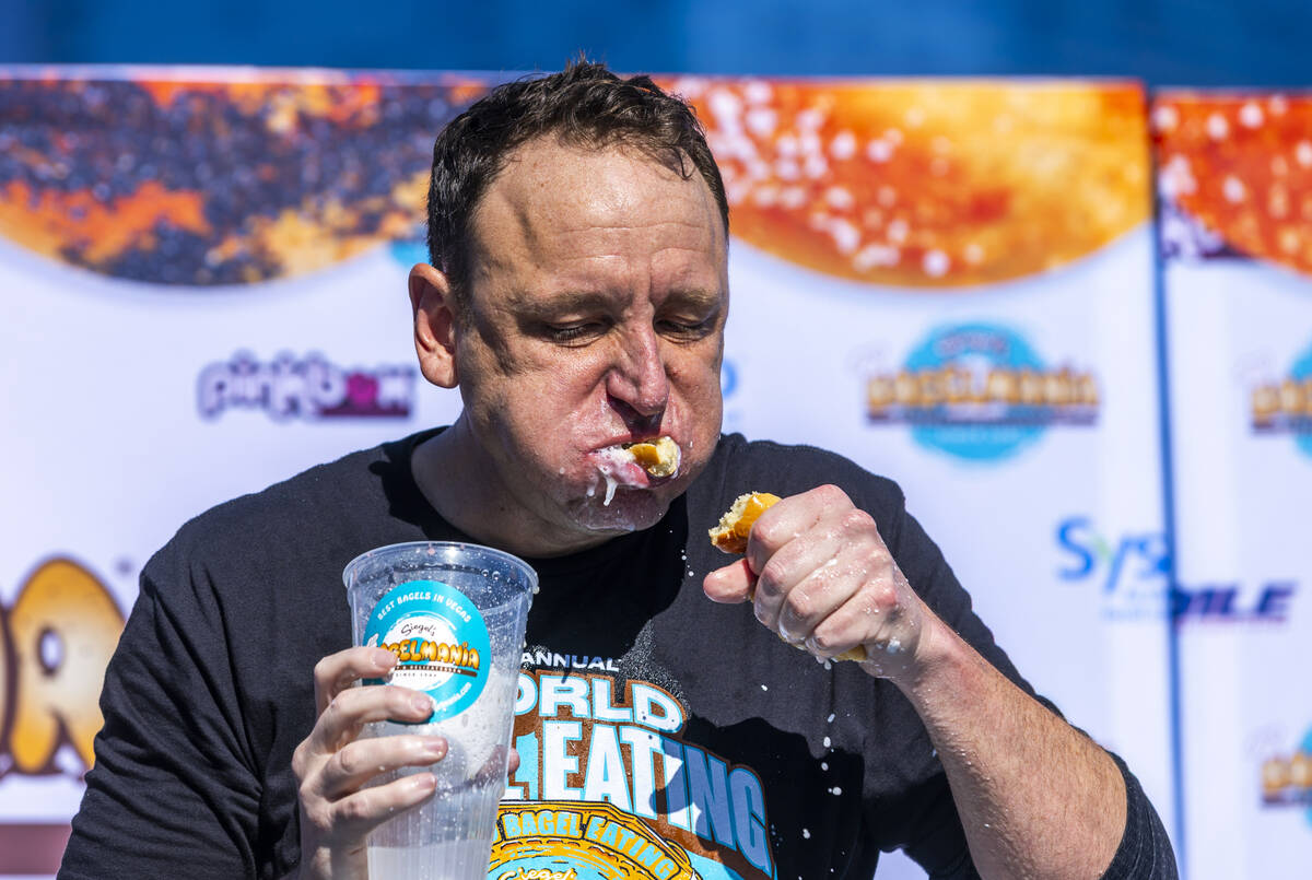 Joey Chestnut, the number-one-ranked competitive eater in the world, devours another bagel as h ...